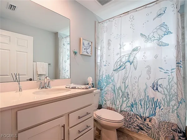 a bathroom with a sink and toilet