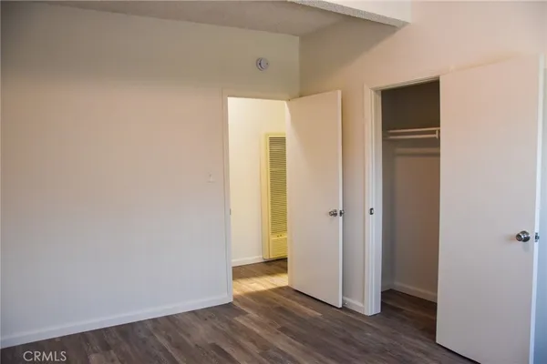 a view of a small space with wooden floor