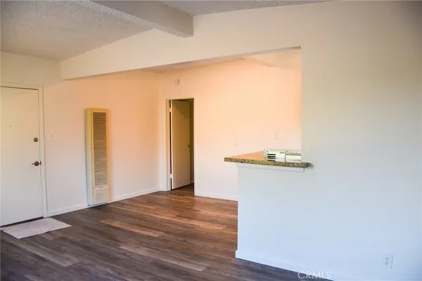 a view of a livingroom with wooden floor