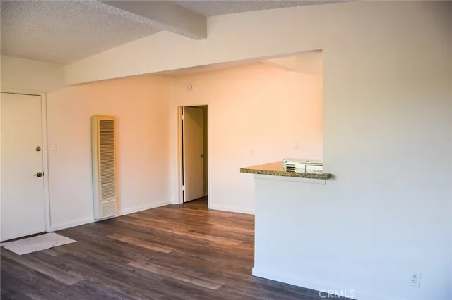 a view of a livingroom with wooden floor