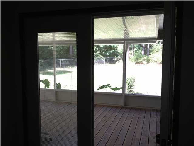 6178 Garden City Road Crestview, FL 32539 - Photo 12 of 14 a view of an empty room and wooden floor