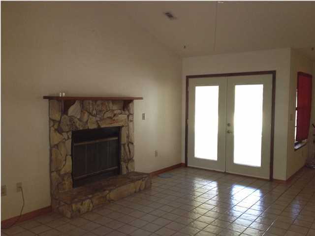 6178 Garden City Road Crestview, FL 32539 - Photo 14 of 14 a view of an empty room with wooden floor and a window