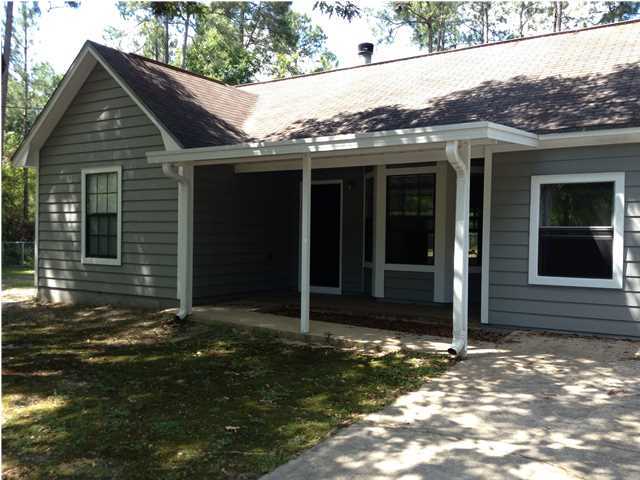 6178 Garden City Road Crestview, FL 32539 - Photo 3 of 14 a view of a house with a yard