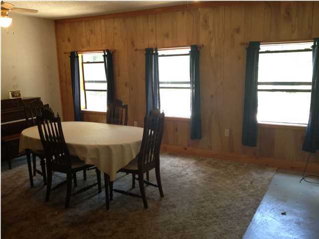 6178 Garden City Road Crestview, FL 32539 - Photo 8 of 14 a view of a dining room with furniture and window