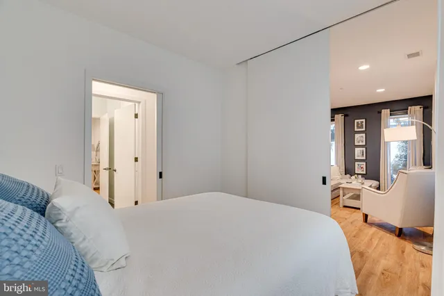 a bathroom with a shower sink and mirror