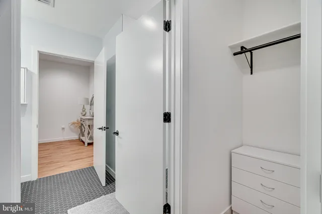 a kitchen with stainless steel appliances a refrigerator and a stove top oven