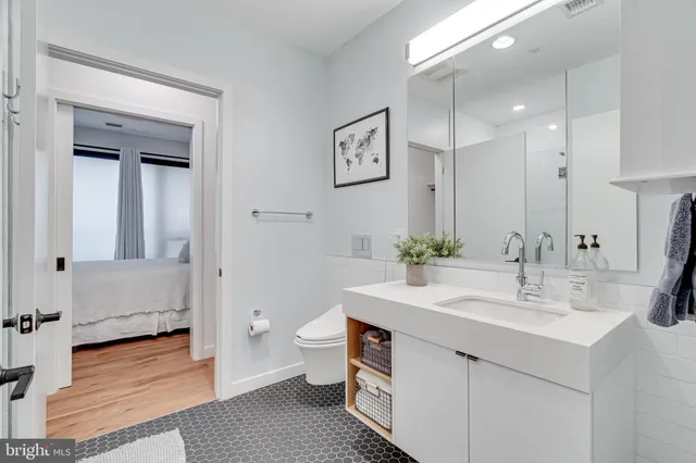 a kitchen with stainless steel appliances granite countertop a stove and cabinets