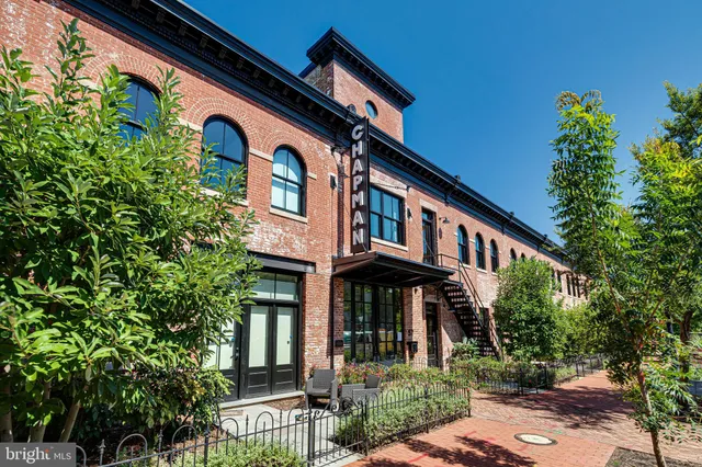 a view of a car park in front of house
