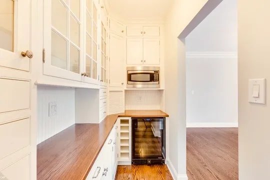 a view of a kitchen from the hallway