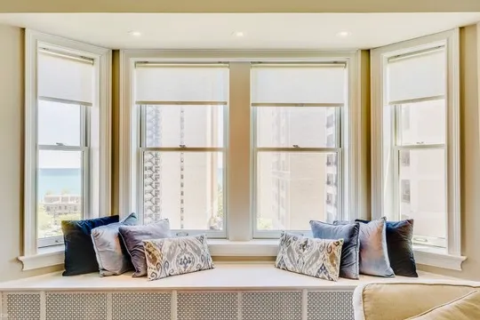 a living room with furniture and windows