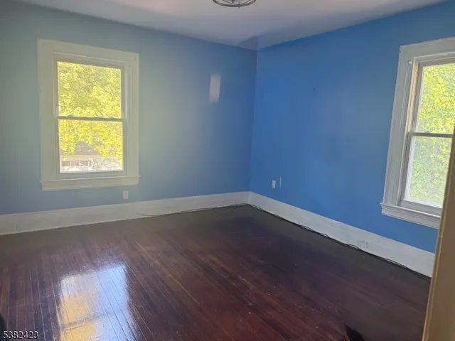 a white bath tub sitting in a bathroom next to a window