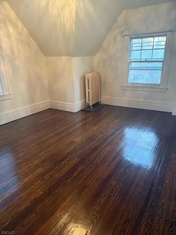 a bathroom with a granite countertop sink a toilet and a bathtub