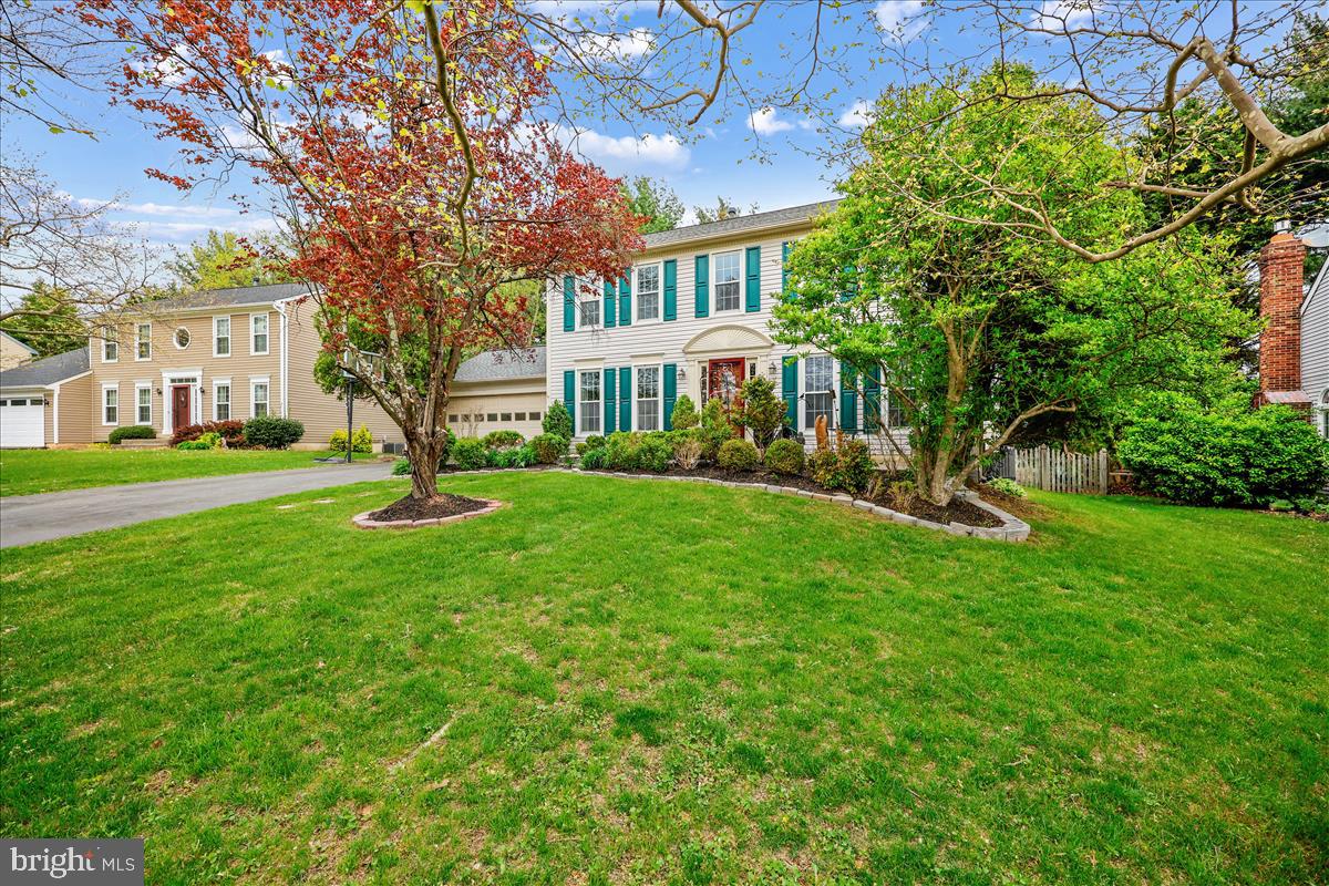 6132 Cornwall Terrace Frederick, MD 21701 - Photo 2 of 48 a view of house in front of a big yard with large trees