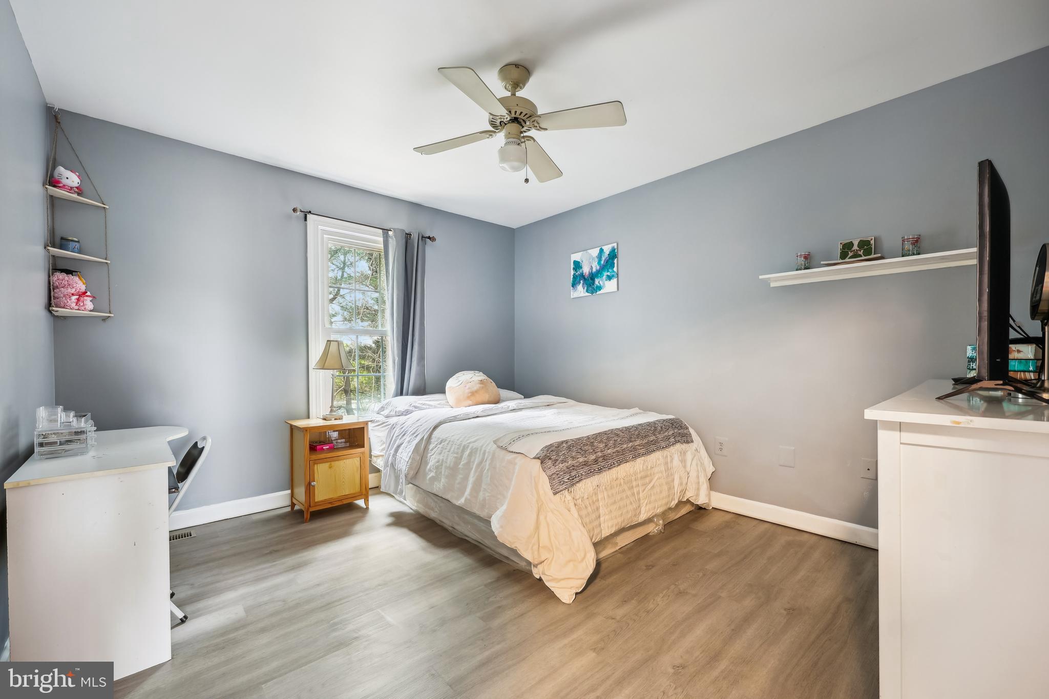 6132 Cornwall Terrace Frederick, MD 21701 - Photo 23 of 48 a bedroom with a bed and a table in it