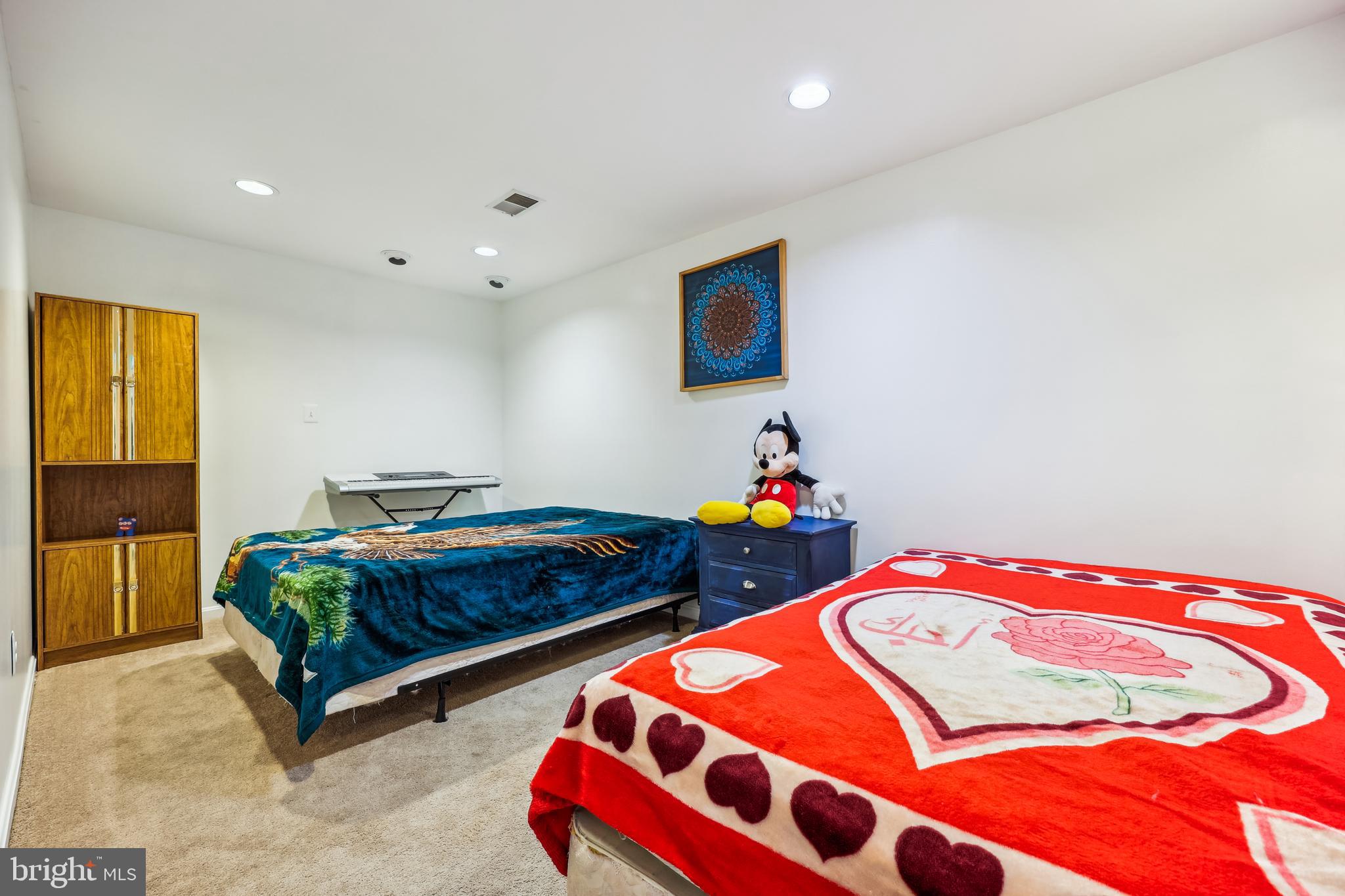 6132 Cornwall Terrace Frederick, MD 21701 - Photo 32 of 48 a bedroom with two beds and a couch