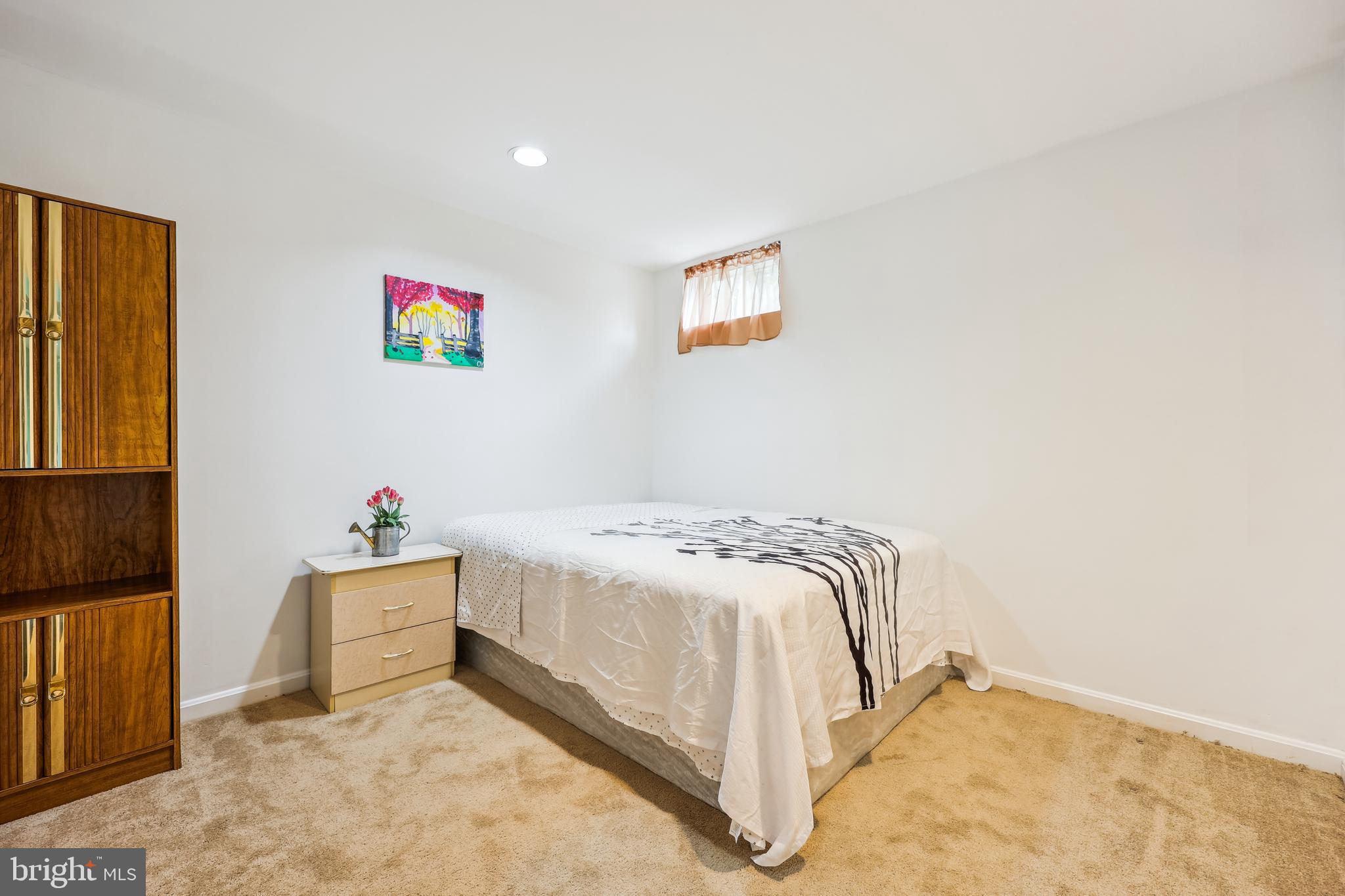 6132 Cornwall Terrace Frederick, MD 21701 - Photo 33 of 48 a bedroom with a bed and a cabinets