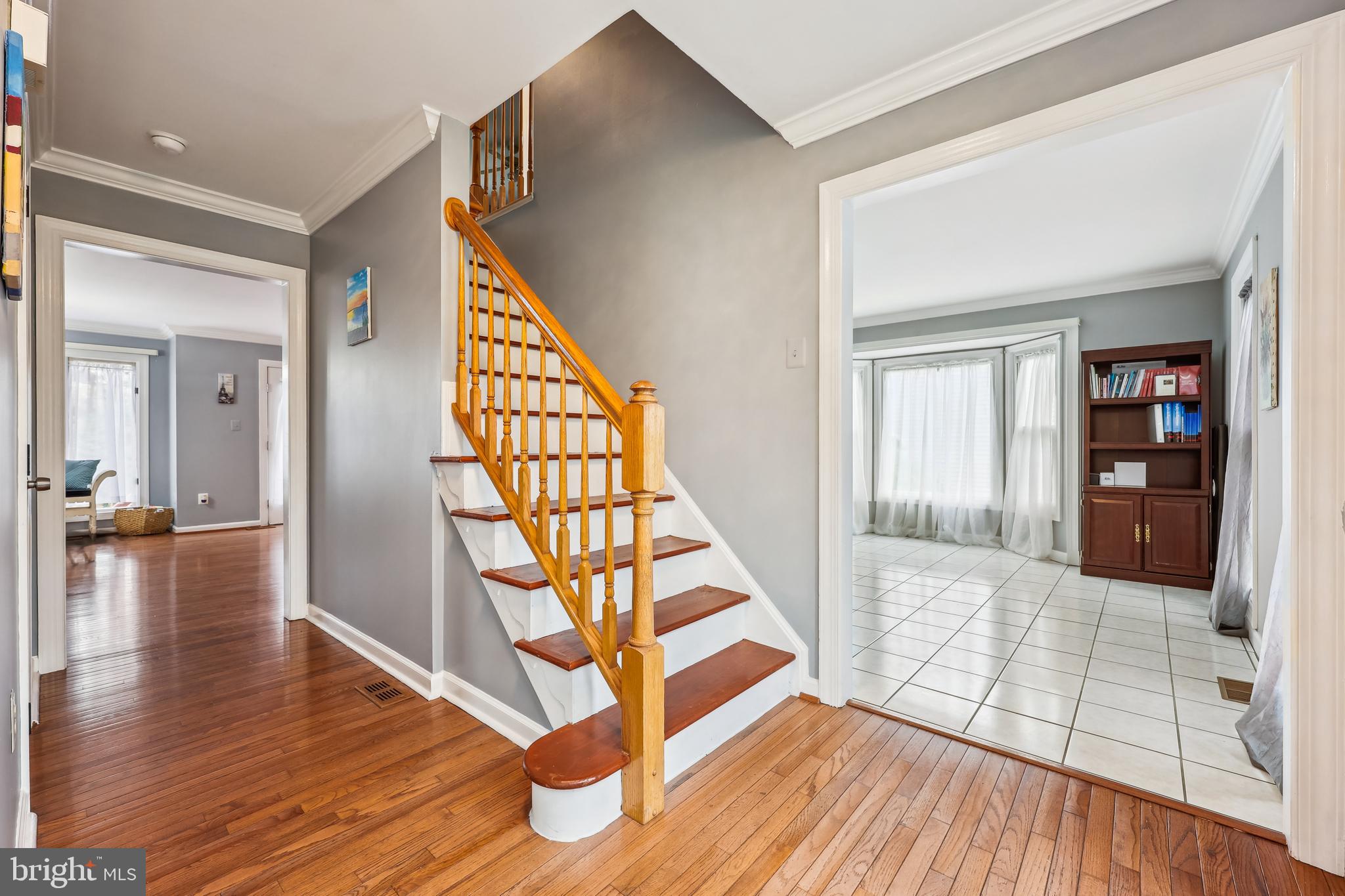 6132 Cornwall Terrace Frederick, MD 21701 - Photo 4 of 48 a view of entryway with wooden floor and stairs