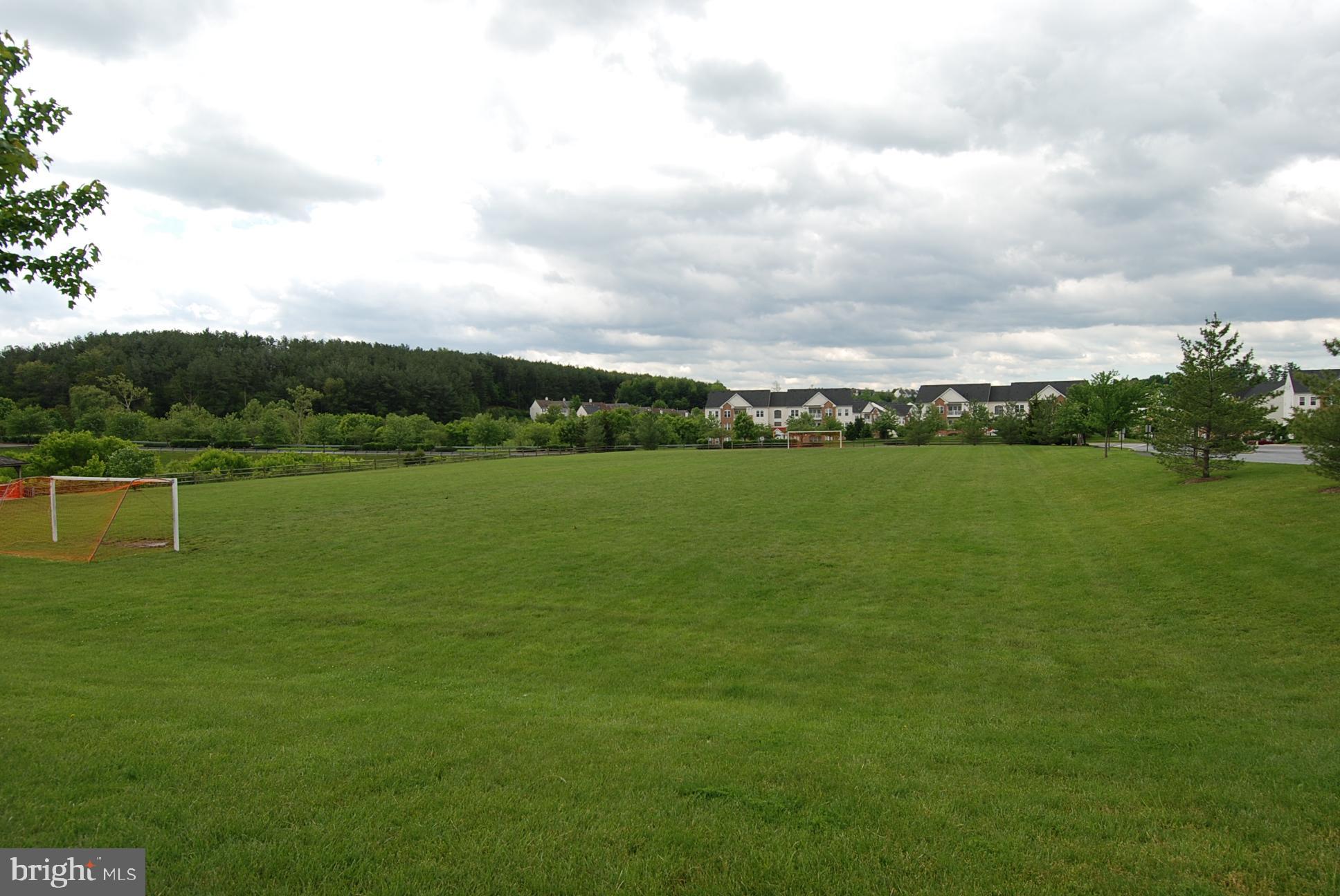 6132 Cornwall Terrace Frederick, MD 21701 - Photo 45 of 48 a view of a lake with a big yard
