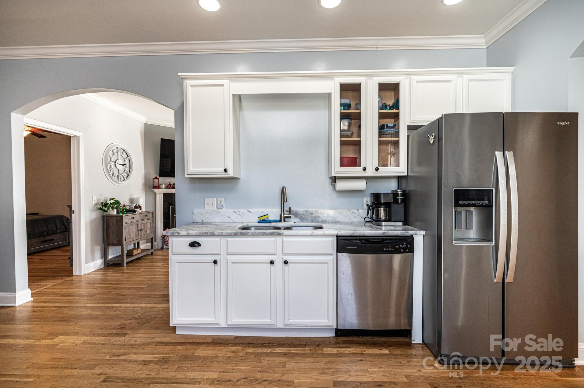 1781 Herbie Circle Newton, NC 28658 - Photo 15 of 38 a kitchen with stainless steel appliances granite countertop a refrigerator a stove and a sink