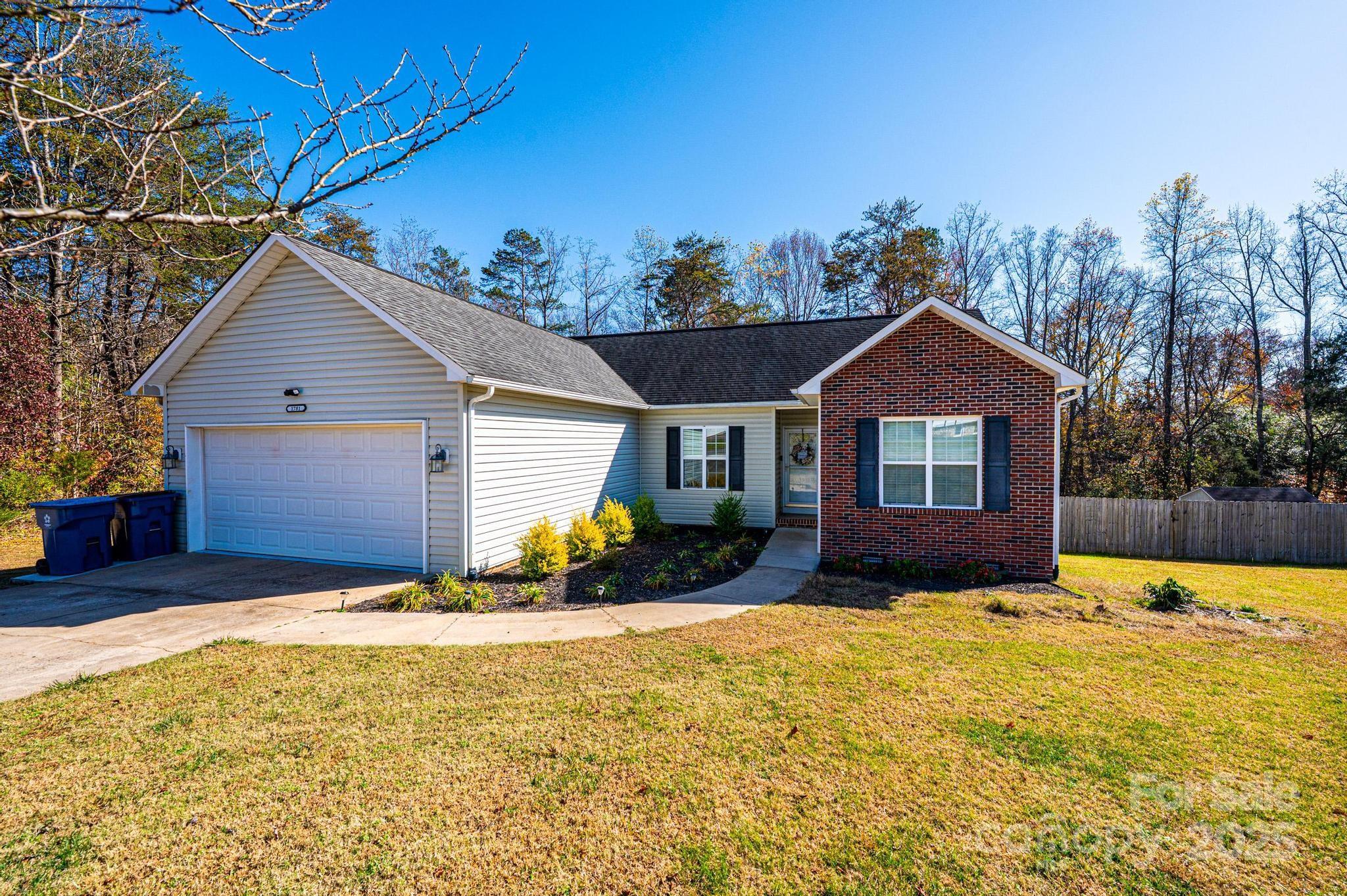 1781 Herbie Circle Newton, NC 28658 - Photo 2 of 38 a front view of a house with a yard outdoor seating and yard