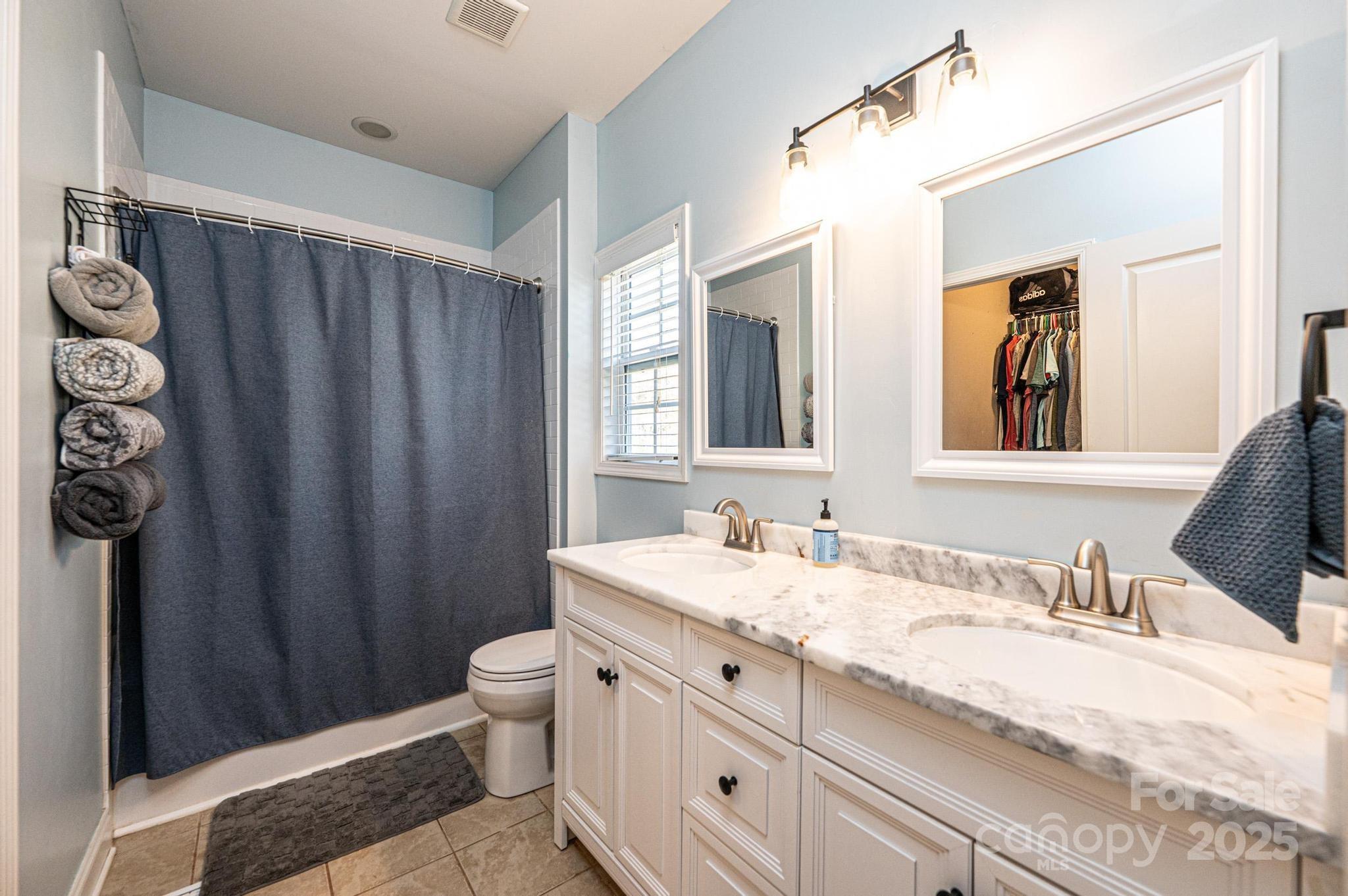 1781 Herbie Circle Newton, NC 28658 - Photo 21 of 38 a bathroom with a granite countertop sink and a mirror