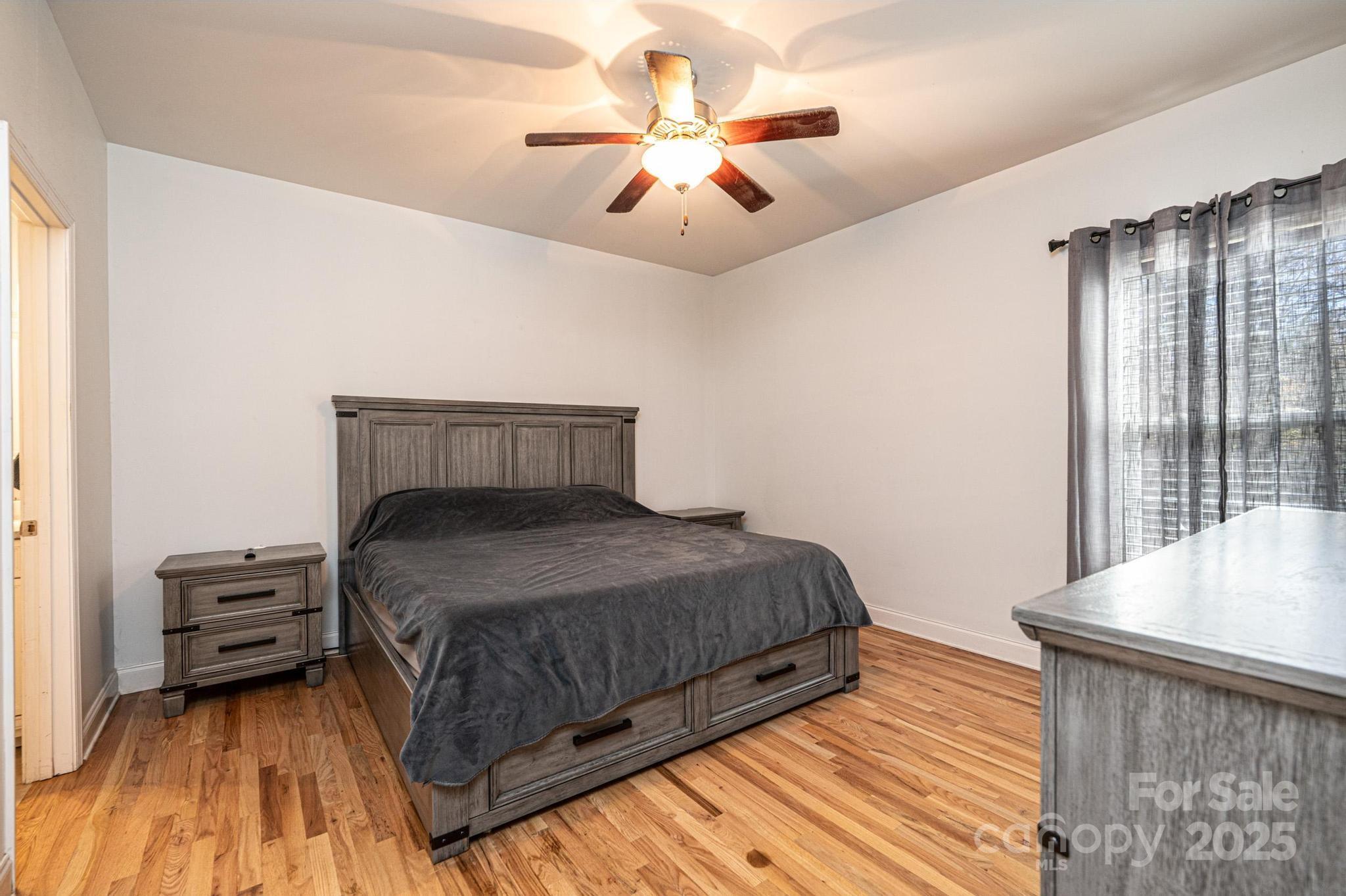 1781 Herbie Circle Newton, NC 28658 - Photo 22 of 38 a bedroom with a bed and a ceiling fan