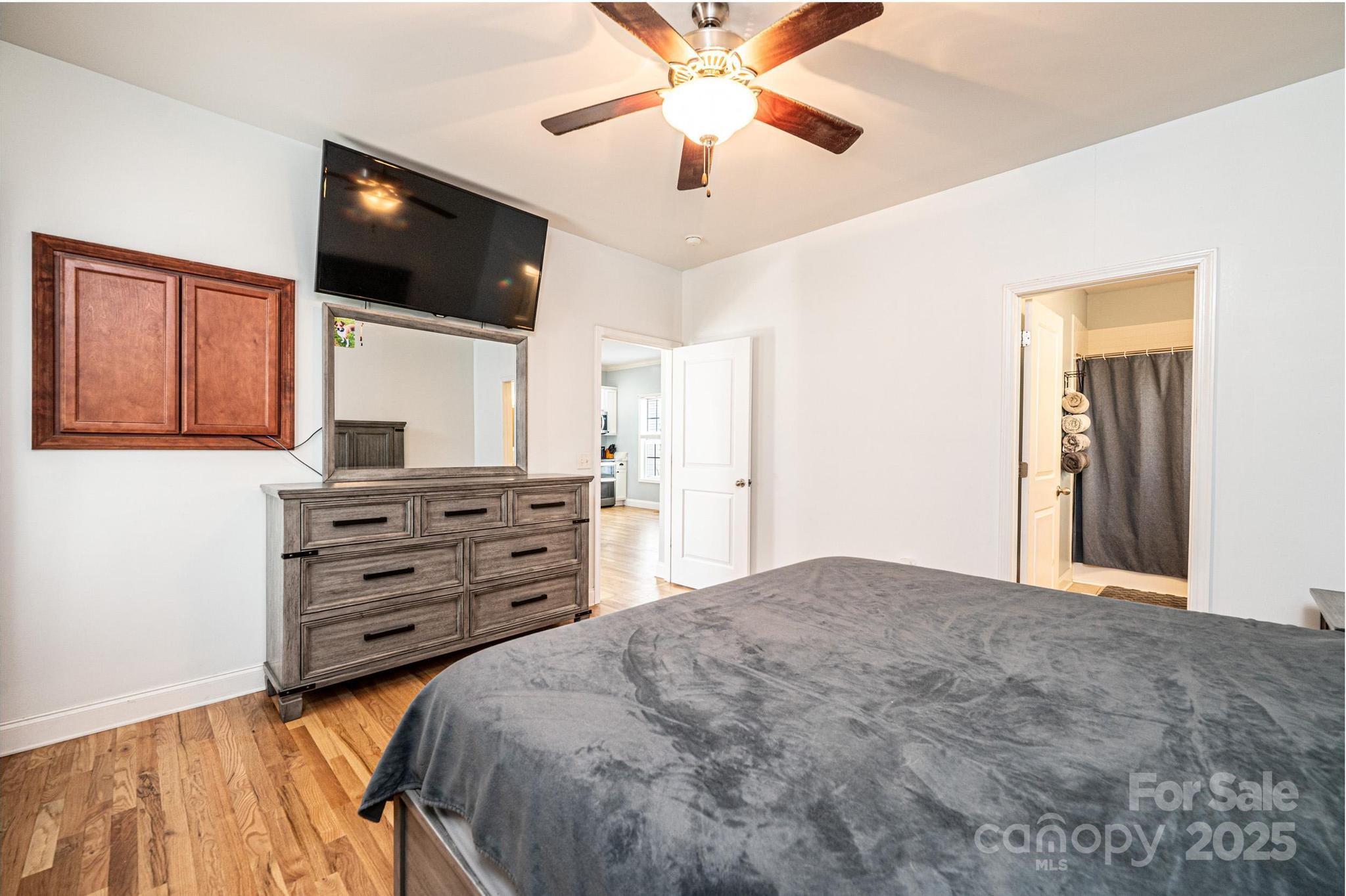 1781 Herbie Circle Newton, NC 28658 - Photo 24 of 38 a bedroom with a bed and a flat screen tv