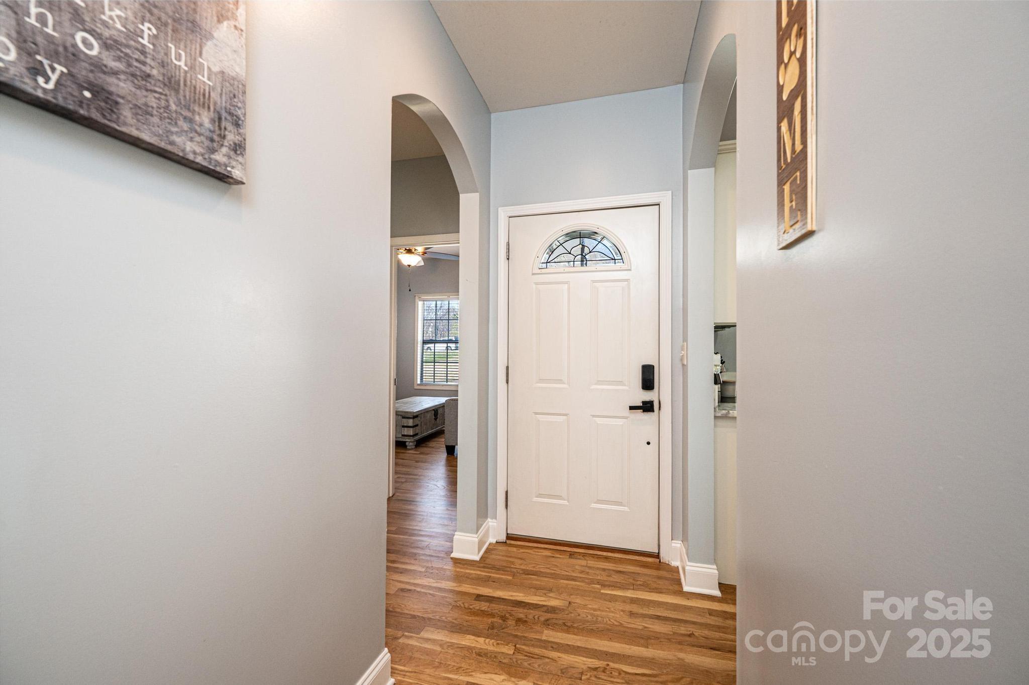 1781 Herbie Circle Newton, NC 28658 - Photo 4 of 38 a view of a hallway with wooden floor and a bathroom