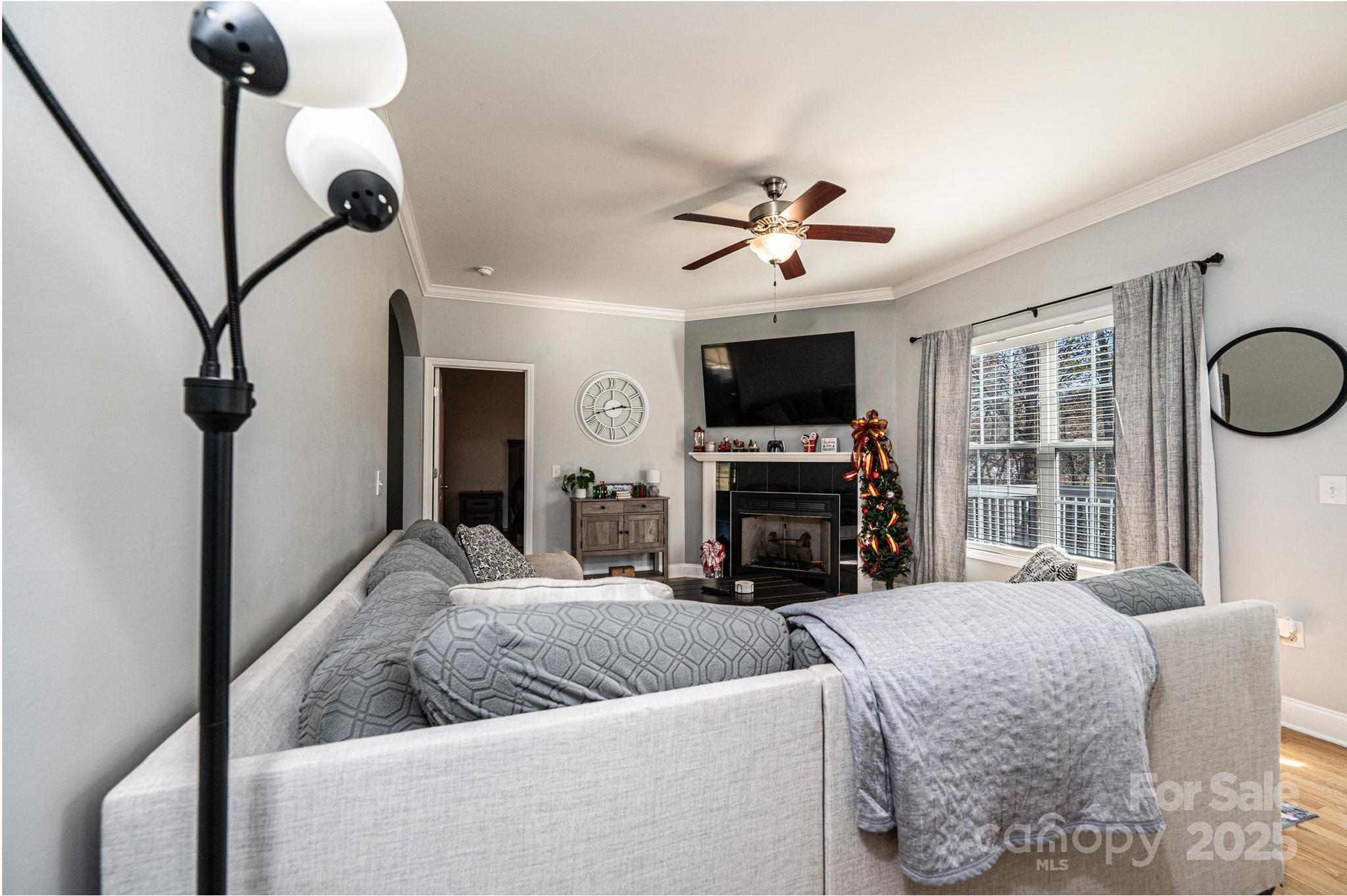 1781 Herbie Circle Newton, NC 28658 - Photo 7 of 38 a living room with furniture a fireplace and a flat screen tv