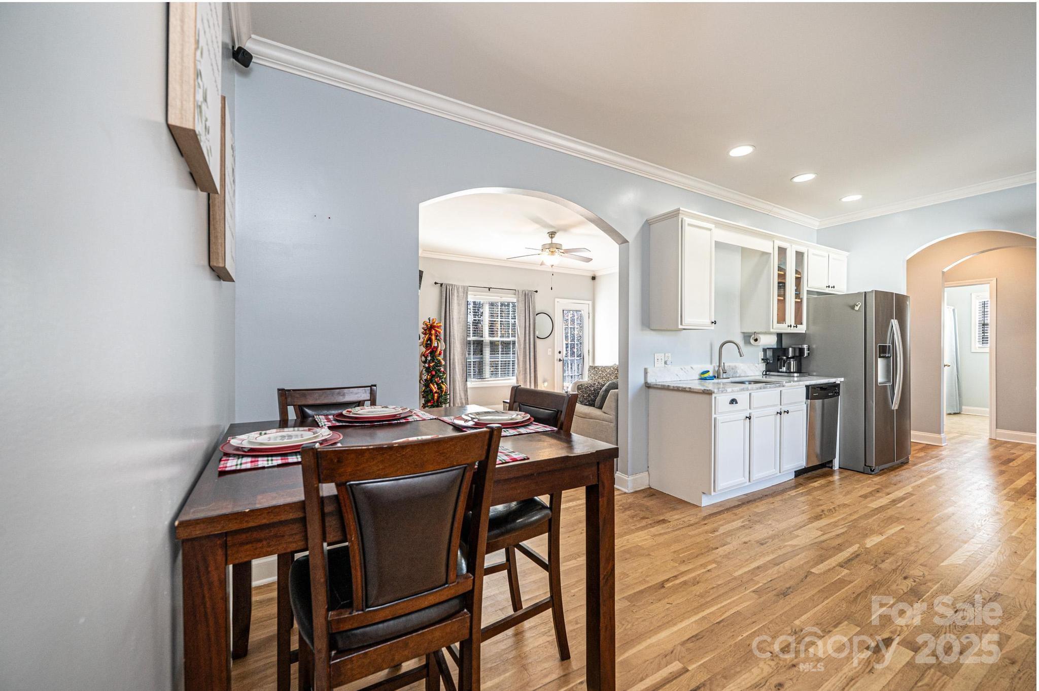 1781 Herbie Circle Newton, NC 28658 - Photo 10 of 38 a view of a dining room with furniture and wooden floor