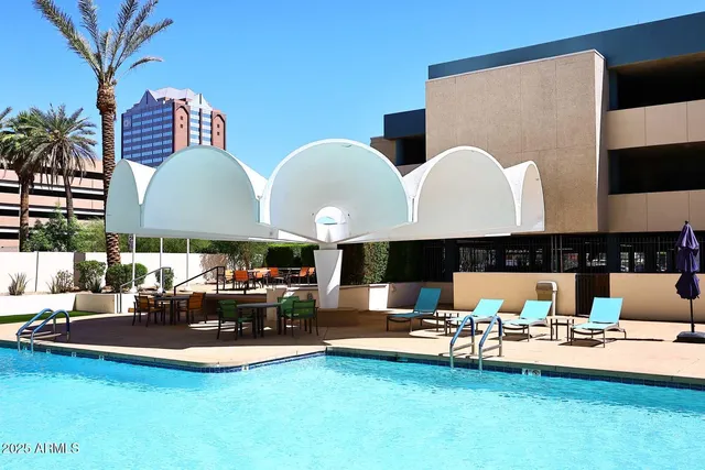 a view of a terrace with seating space and trees