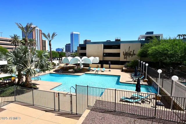 a view of a swimming pool with a lounge chairs