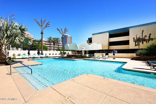 a view of a potted plants next to a white building