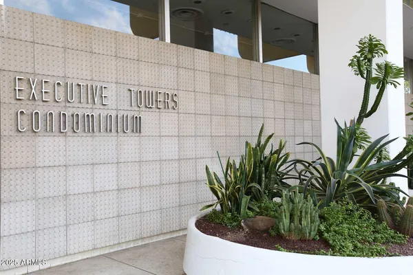 a view of a swimming pool with a lounge chair