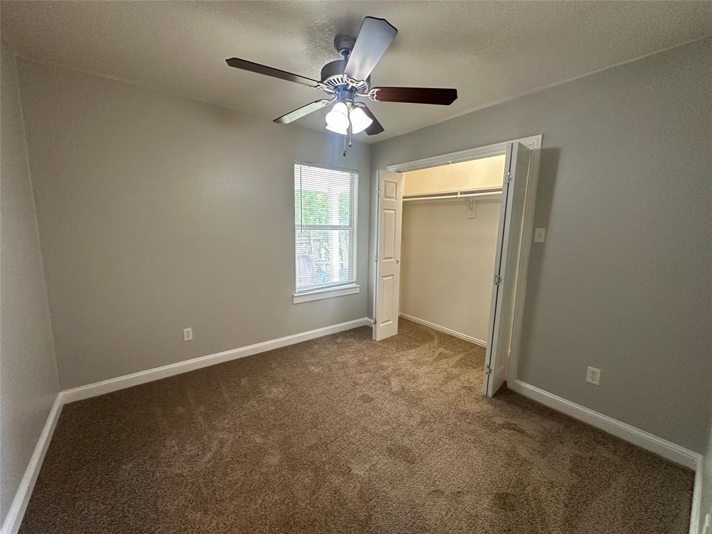 4147 Gladewater Road Dallas, TX 75216 - Photo 18 of 31 an empty room that has a window