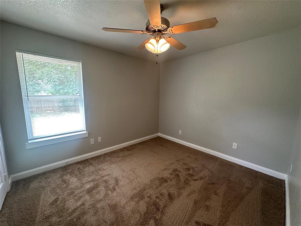 4147 Gladewater Road Dallas, TX 75216 - Photo 20 of 31 an empty room with a window