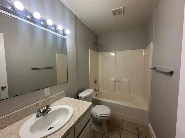 a bathroom with a tub and a shower