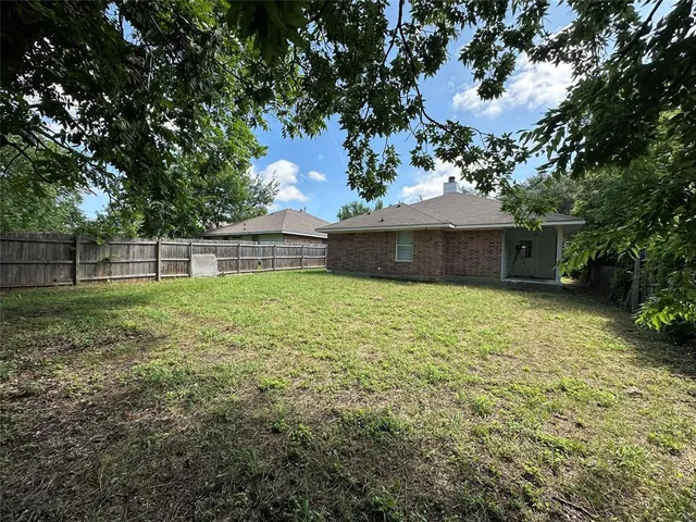 a view of outdoor space with deck and yard