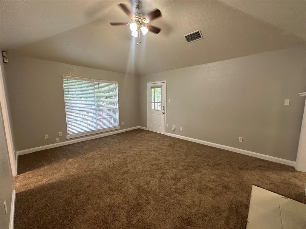 4147 Gladewater Road Dallas, TX 75216 - Photo 4 of 31 a view of an empty room with a window