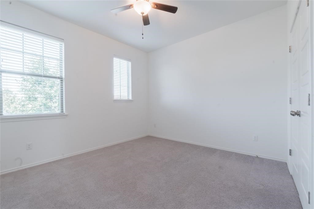 1333 Terrace View Drive Georgetown, TX 78628 - Photo 25 of 35 A well-lit bedroom features ample natural light and a comforting neutral palette.
