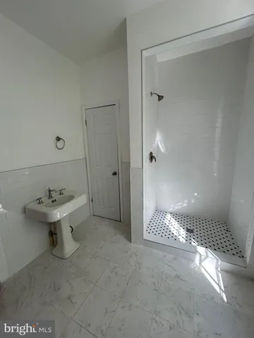 a bathroom with a sink and mirror