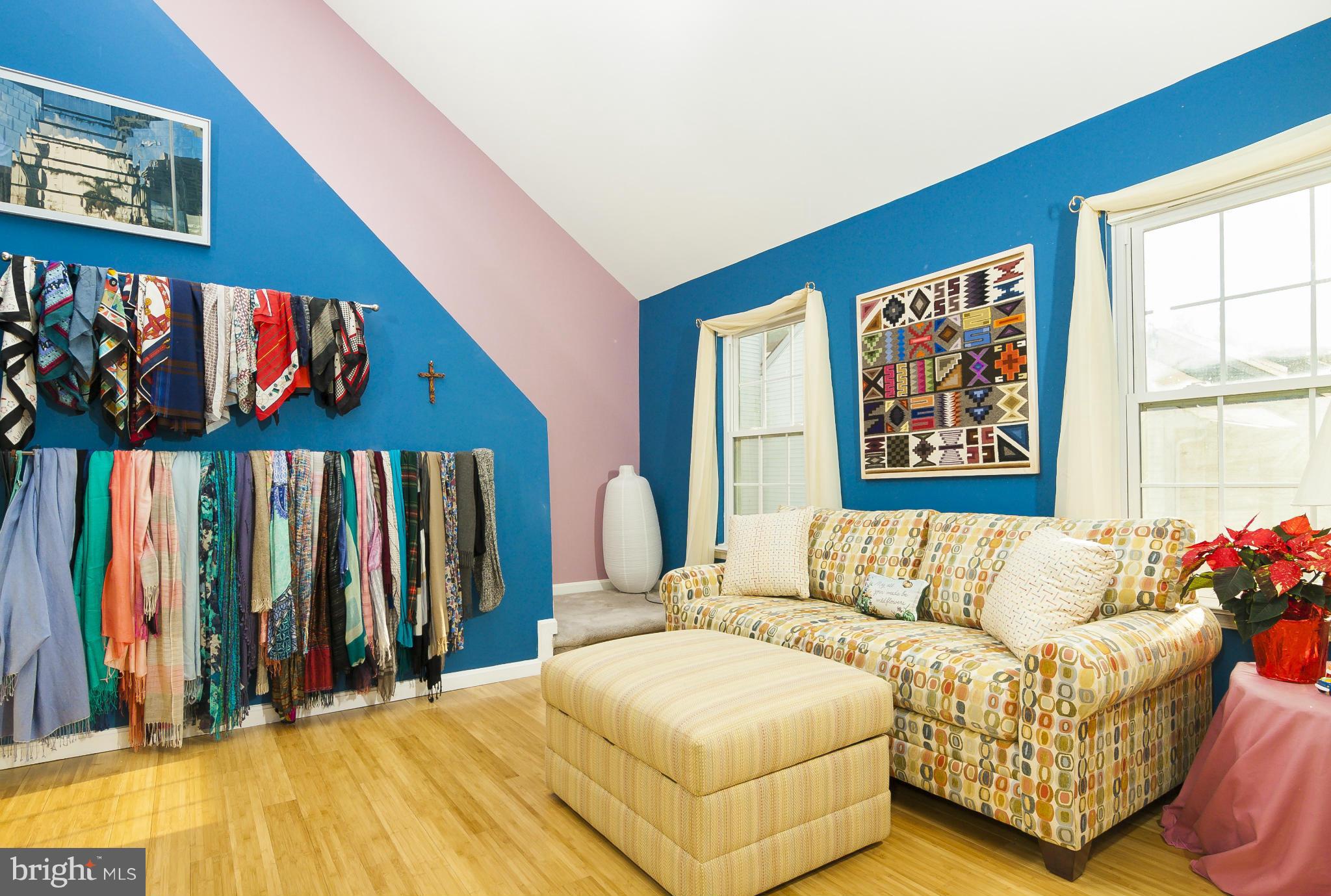 2005 Lyttonsville Road Silver Spring, MD 20910 - Photo 13 of 16 a bedroom with a bed and a painting on the wall