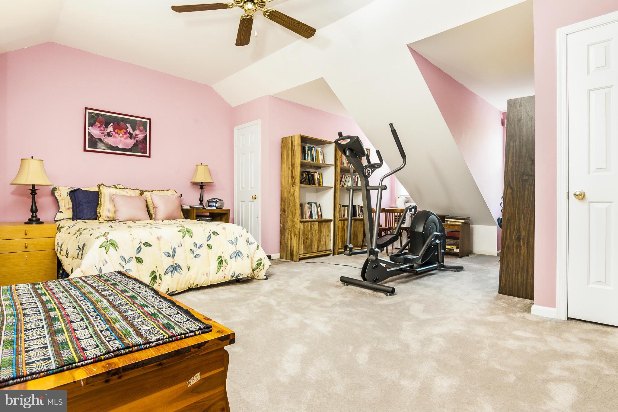 2005 Lyttonsville Road Silver Spring, MD 20910 - Photo 15 of 16 a bedroom with bed and gym equipment