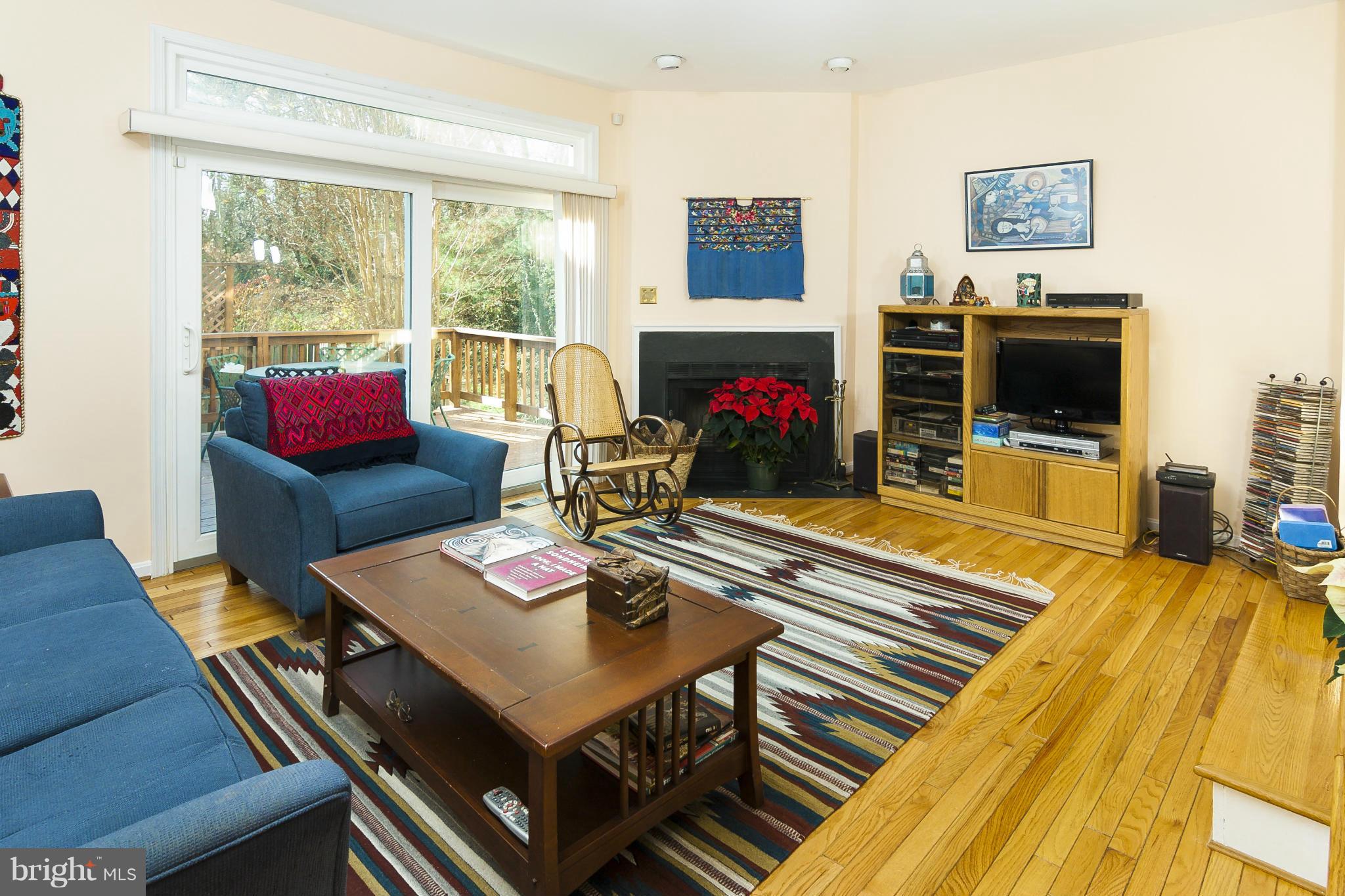 2005 Lyttonsville Road Silver Spring, MD 20910 - Photo 3 of 16 a living room with furniture a flat screen tv and a floor to ceiling window