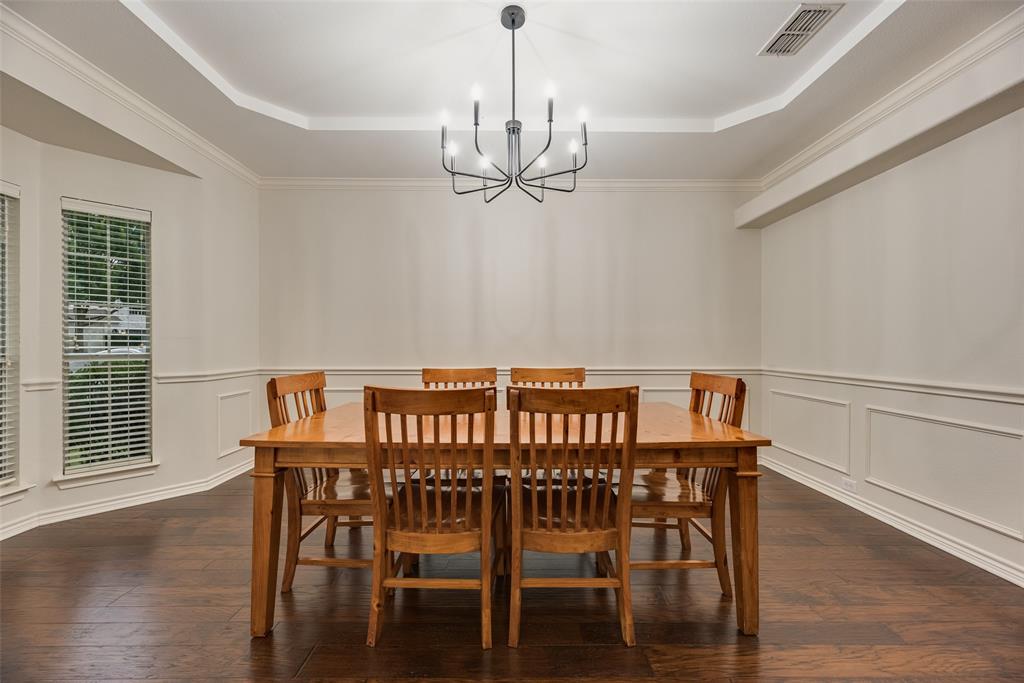 11920 Vienna Apple Road Fort Worth, TX 76244 - Photo 8 of 40 Dining room with hardwood floors, fresh paint and tiered ceiling at 11920 Vienna Apple in Villages of Woodland Springs community in North Fort Worth
