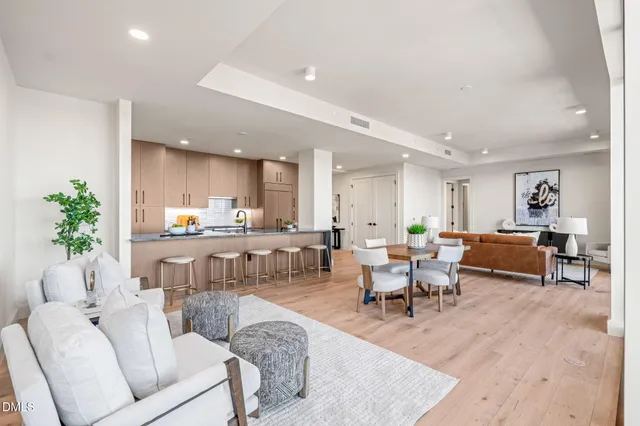 a bathroom with a granite countertop sink mirror and shower