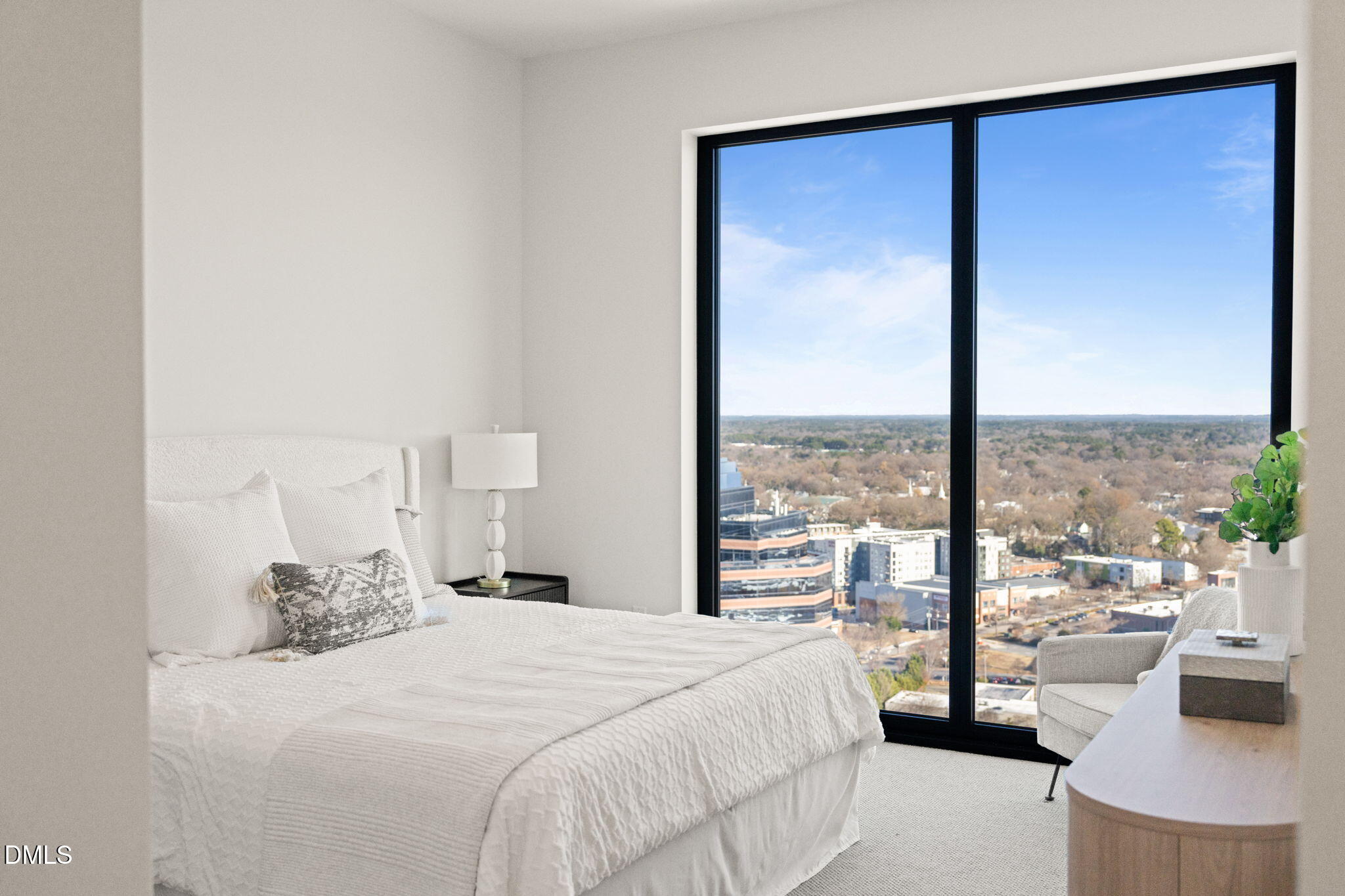 115 Morris Street, Unit 2501 Durham, NC 27701 - Photo 28 of 76 a bedroom with a large bed and a large window