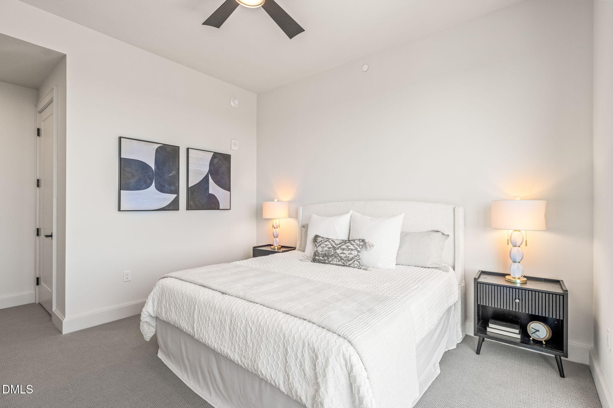 115 Morris Street, Unit 2501 Durham, NC 27701 - Photo 31 of 76 a bedroom with a bed and a painting on the wall