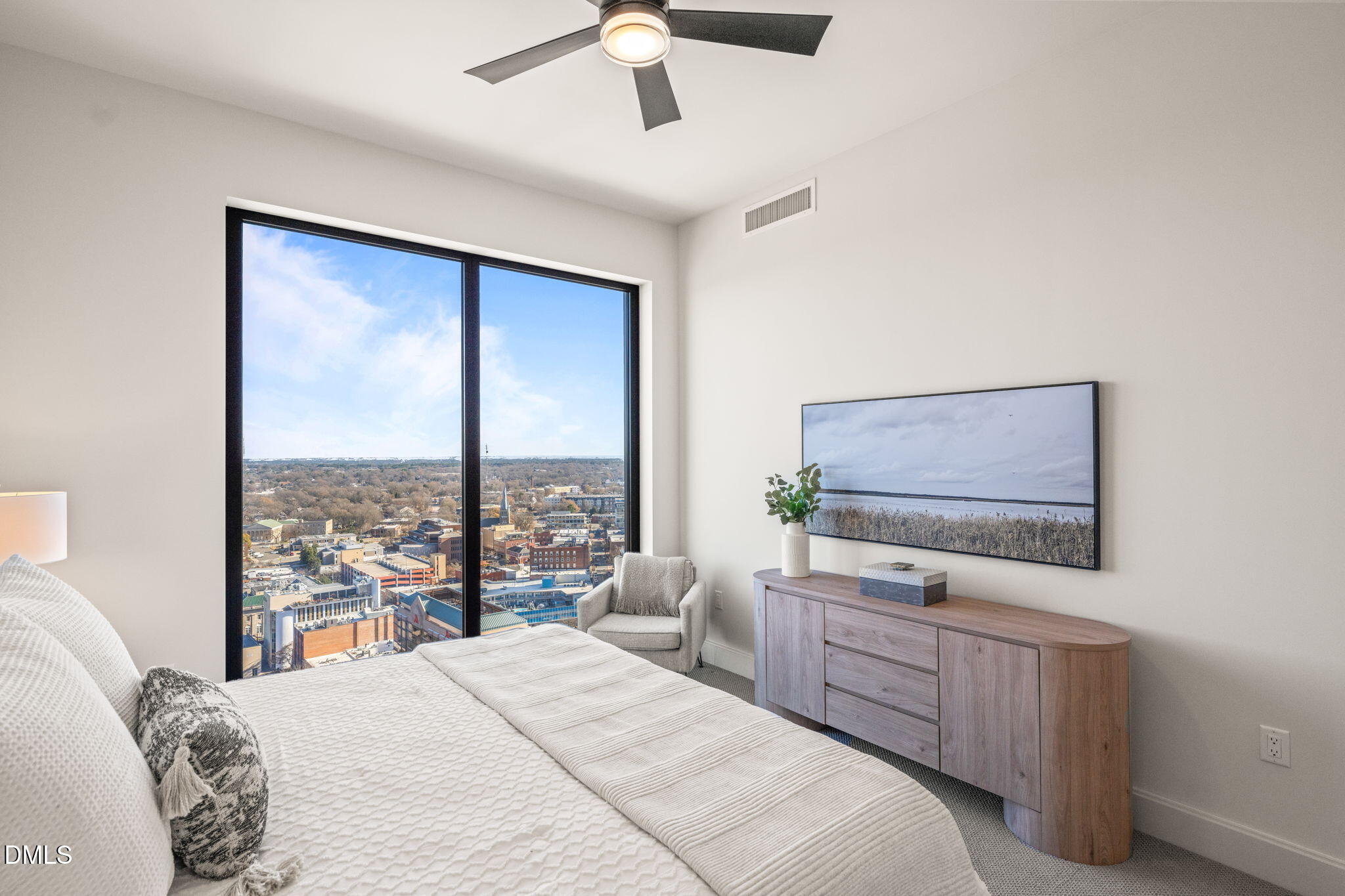 115 Morris Street, Unit 2501 Durham, NC 27701 - Photo 33 of 76 a bedroom with a large bed and a flat tv screen