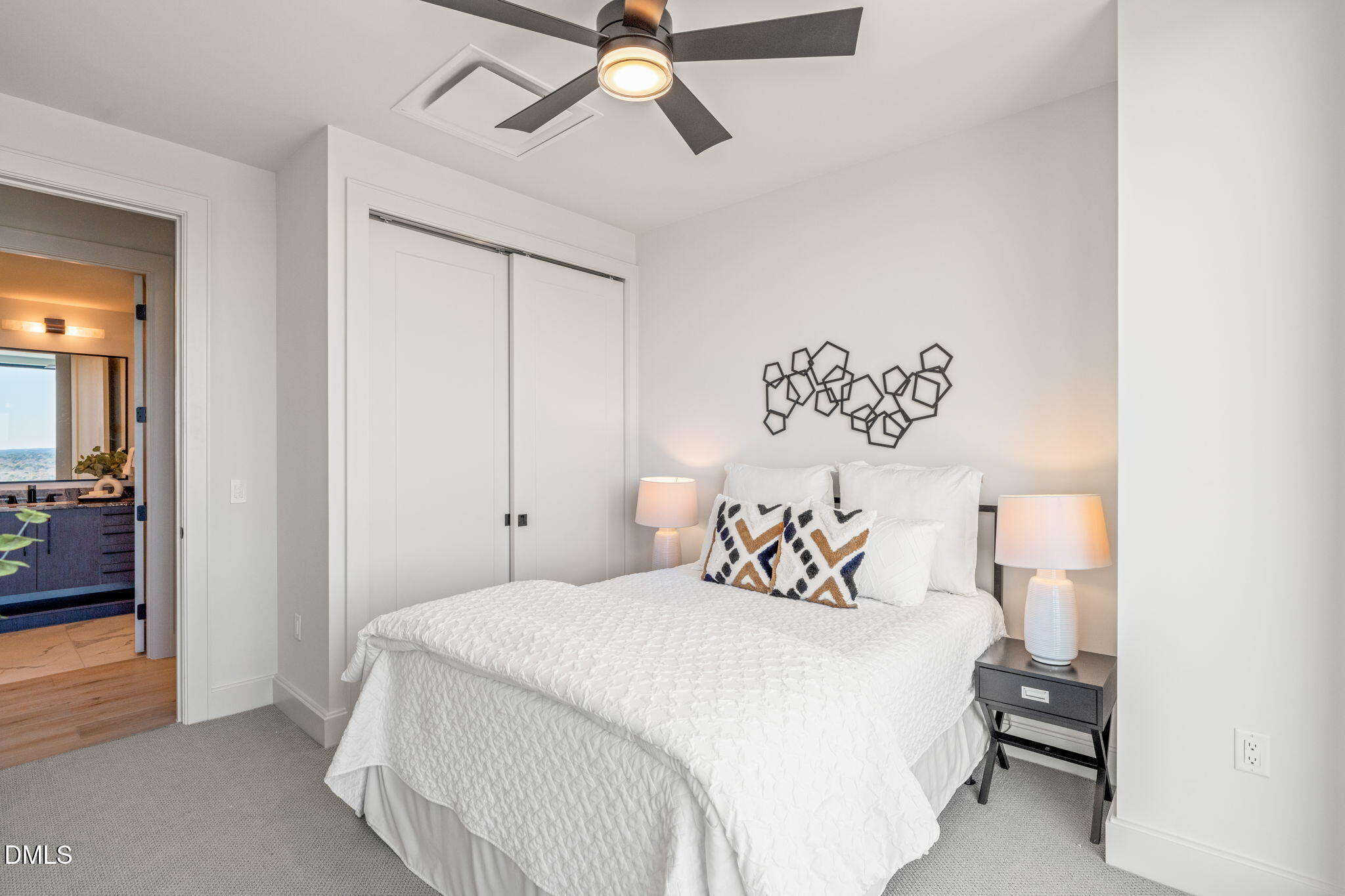 115 Morris Street, Unit 2501 Durham, NC 27701 - Photo 39 of 76 a bedroom with a bed and a view of bathroom